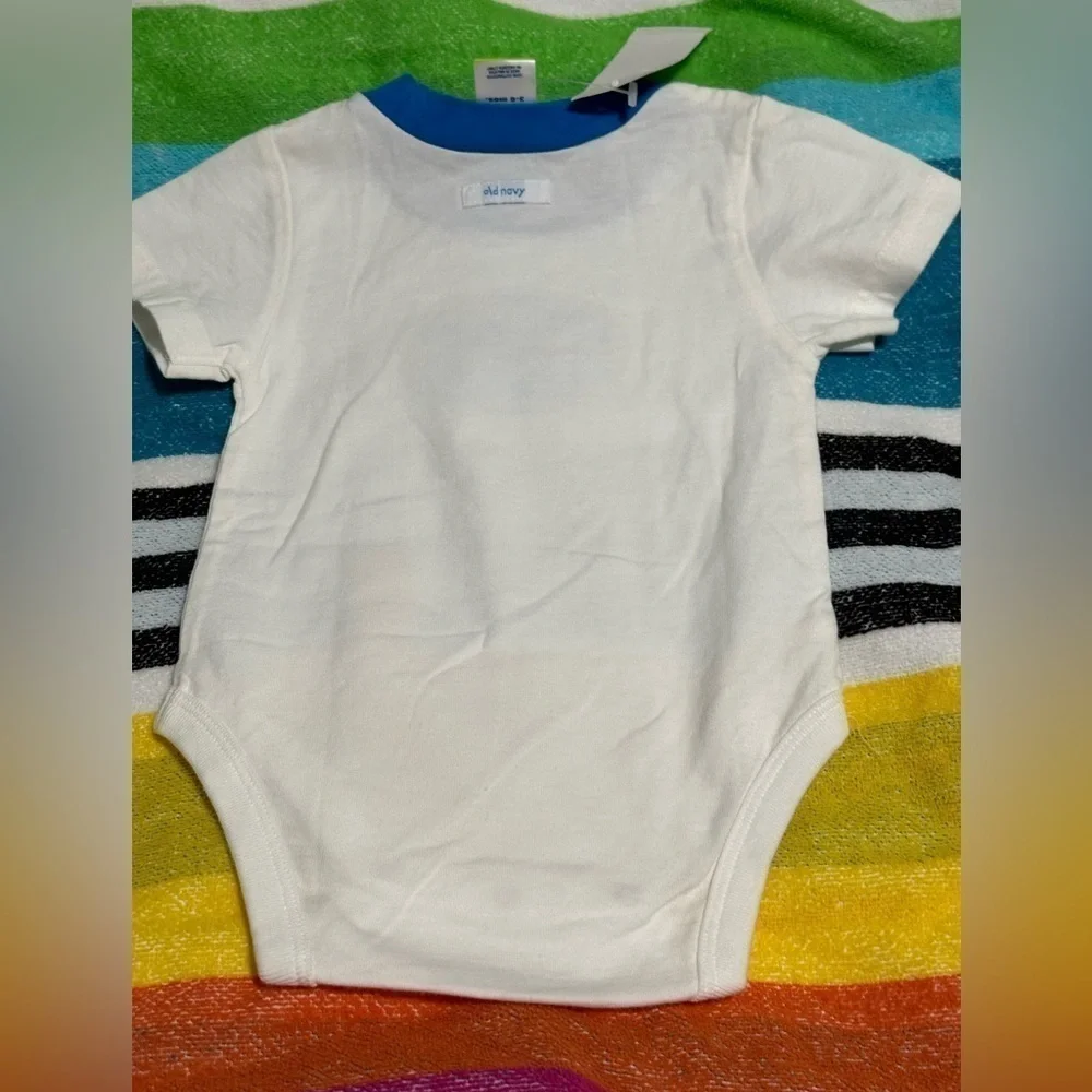Old Navy onesie. White with blue trim & decal. Size 3-6 months. New with tags